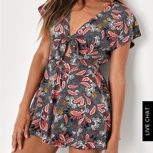 Brand new with tag. Lulus romper size M. Navy blue, yellow and red print.